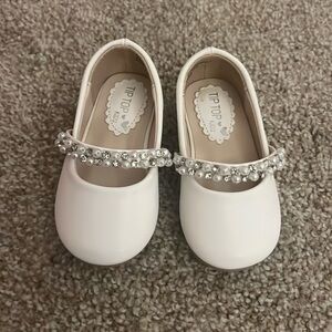 Baby girl white and pearl dress shoes.